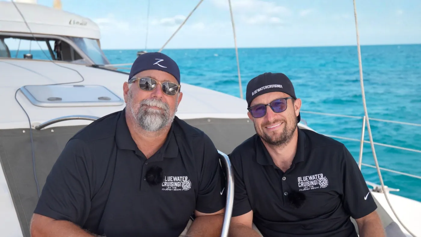 Bluewater Cruising founders aboard a catamaran